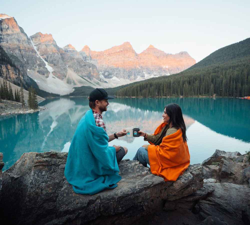 Couple enjoying a tour at Moraine Lake near Lake Louise