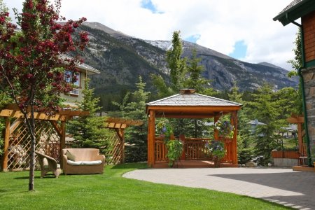 A view of the grounds and gazebo at A Bear & Bison Inn, Canmore, Alberta.