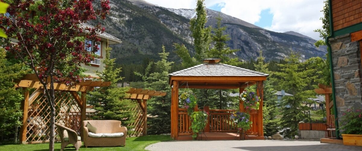 A view of the grounds and gazebo at A Bear & Bison Inn, Canmore, Alberta.